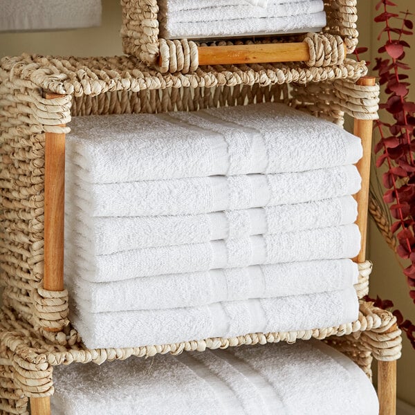 A stack of white Lavex bath towels.