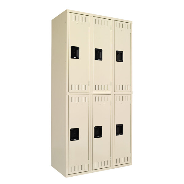A beige Tennsco steel locker with black handles and three doors stacked on top of each other.