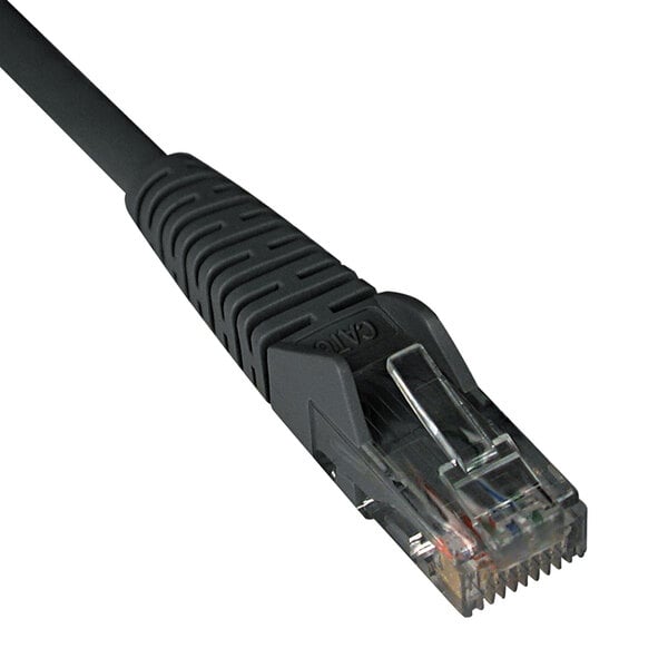 A close-up of a black Tripp Lite Cat6 Ethernet cable with snagless molding.
