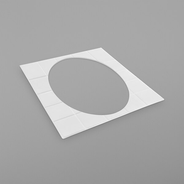 A white square tile with a circle in the middle.