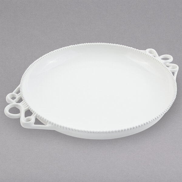 A white Bon Chef cast aluminum platter with handles.