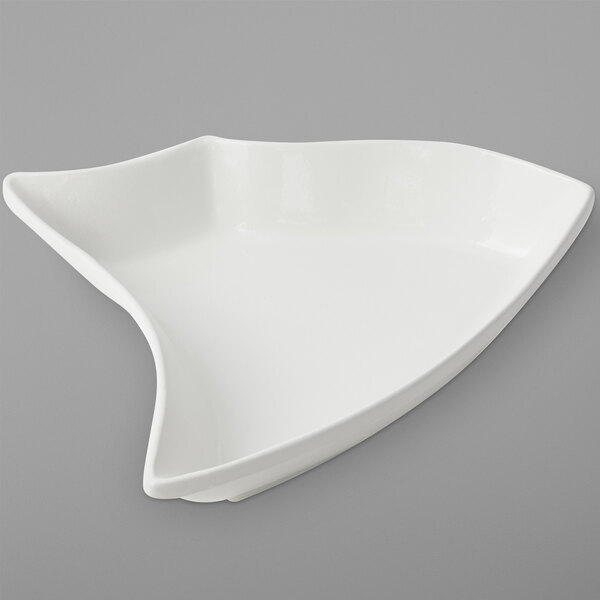 A white Bon Chef curved cast aluminum bowl.