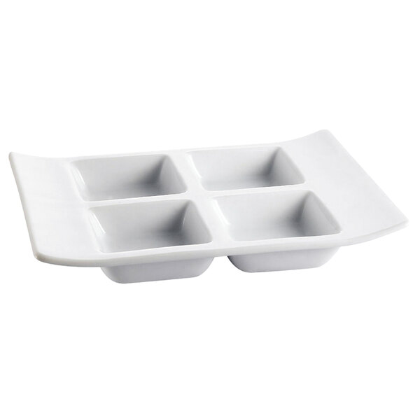 A white porcelain rectangular tray with four compartments.