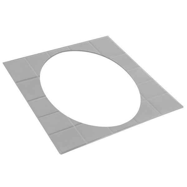 A white oval tile with a white circle and a hole in the middle.