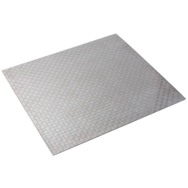 A stainless steel square tile with a circle pattern.