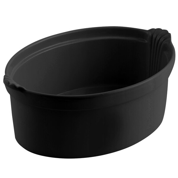 A black oval casserole dish with shell handles.