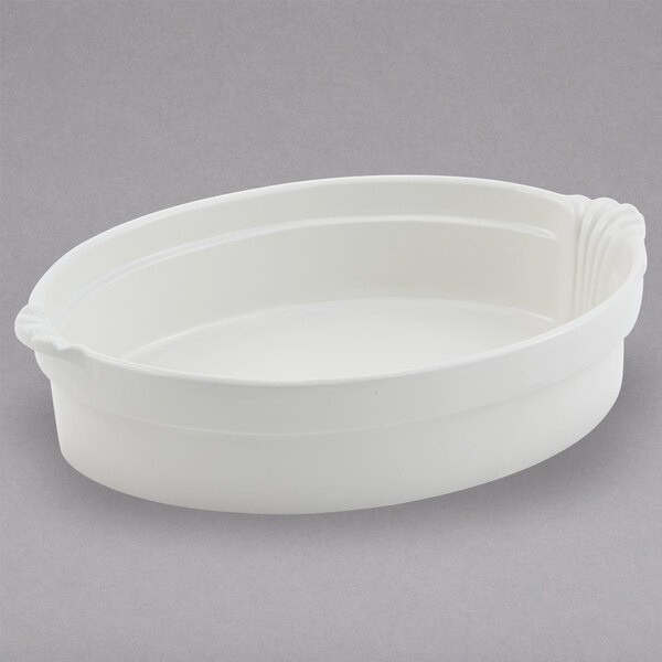 A white oval shaped dish with shell handles.