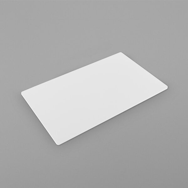 A white rectangular Bonstone tile on a gray surface.