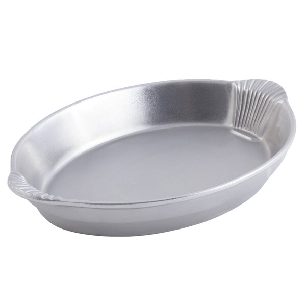 A silver oval pan with shell handles.