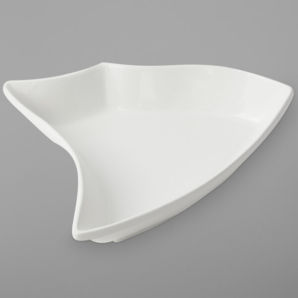 A white Bon Chef Futura cast aluminum bowl with a curved edge.
