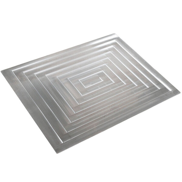A stainless steel rectangular tile with lines.