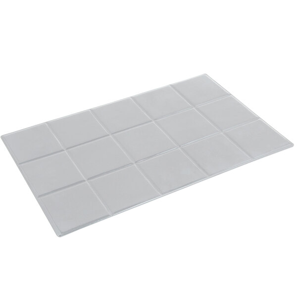 A white rectangular tile with a square pattern.