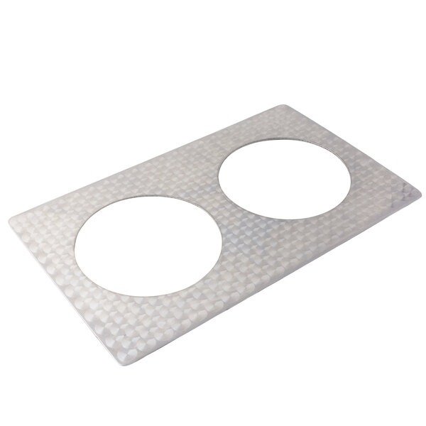A white circle shaped stainless steel tile with two holes.