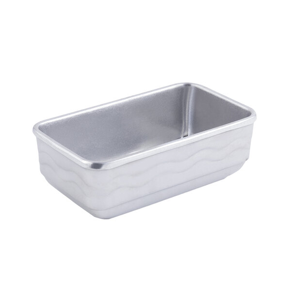 A silver rectangular metal Bon Chef casserole with wavy lines.