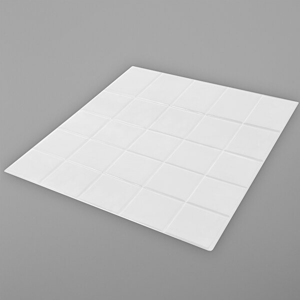 A white square Bon Chef tile with a square pattern.