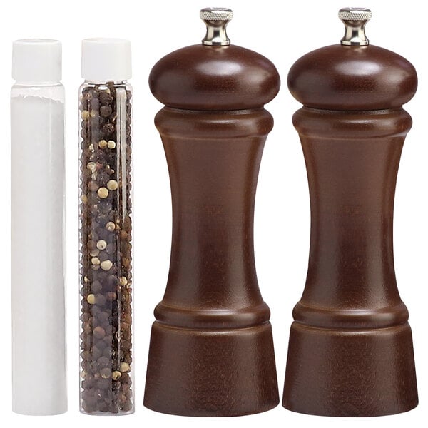 A close-up of the brown walnut pepper mill and salt mill set.