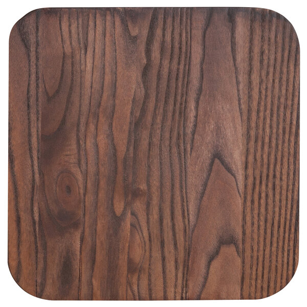A close up of a dark brown rustic walnut wood stool seat.