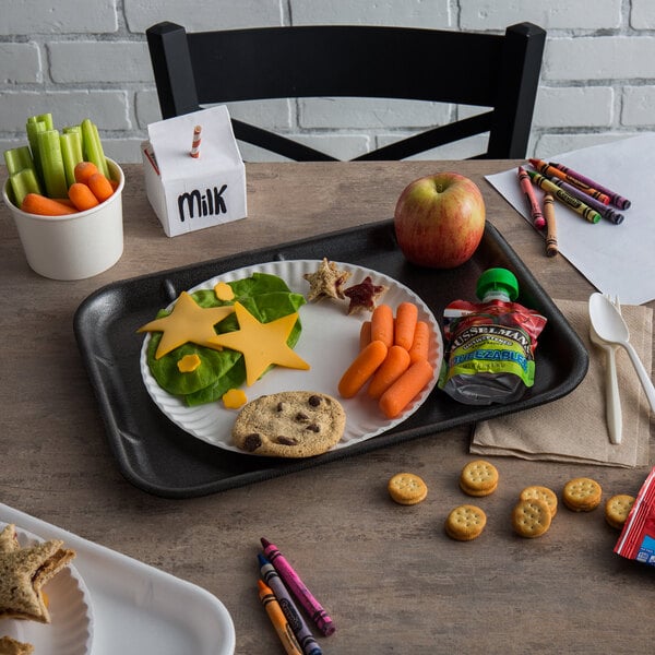 A black CKF foam school tray with food on it and a white plastic spoon.