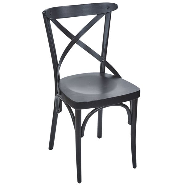 A black BFM Seating Sofia side chair with a wooden seat and cross back.