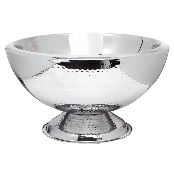A silver Eastern Tabletop punch bowl with a hammered finish and stand.