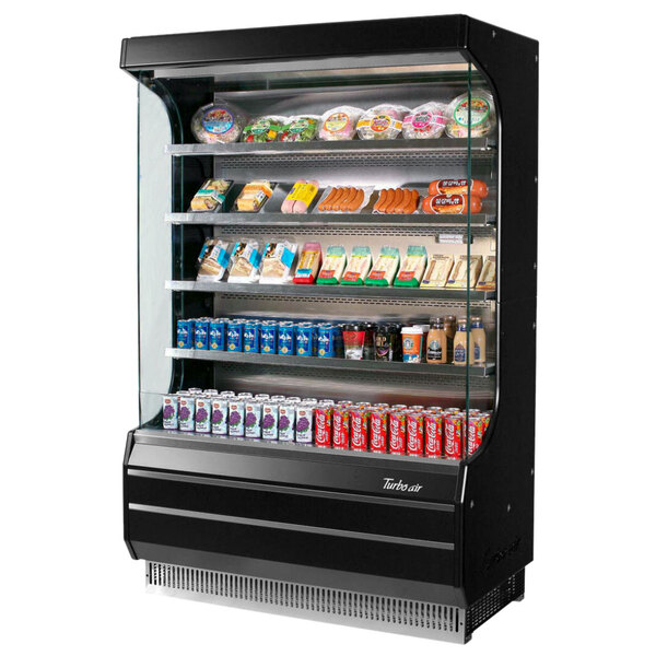 A Turbo Air black refrigerated air curtain merchandiser with food and drinks on shelves inside.