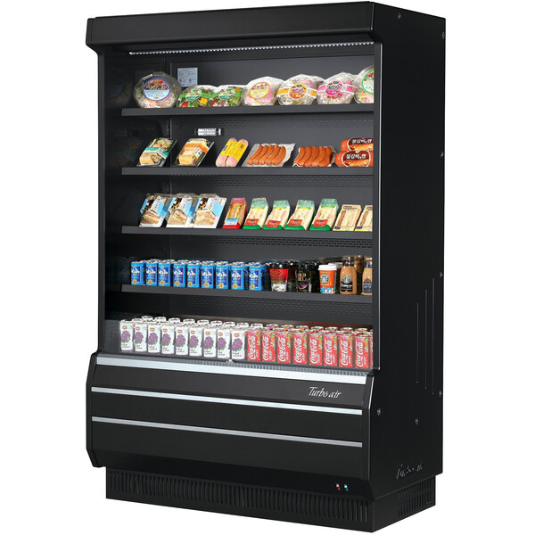 A black refrigerated display case with food on shelves.