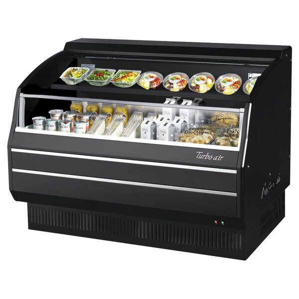A black Turbo Air low profile horizontal air curtain display case with food inside.