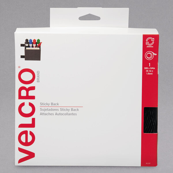 A white box with red and black text containing a roll of 3/4-inch wide black Velcro® hook and loop tape.