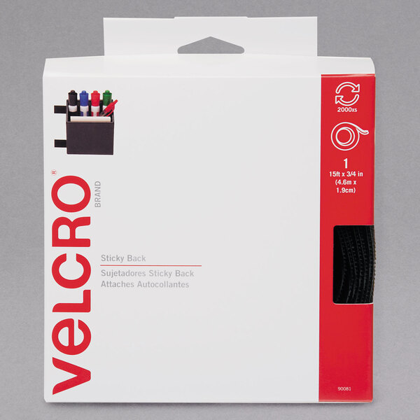 A white box with red and black text containing a roll of Velcro® black sticky-back tape.