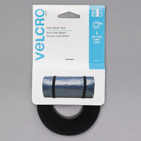 A package of Velcro One-Wrap reusable tie fasteners with a roll of black hook and loop tape inside a blue plastic bag.