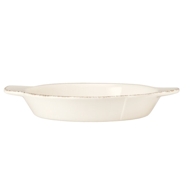 A white round porcelain skillet with a handle.