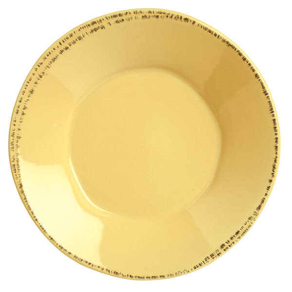 A yellow Libbey porcelain bowl with black writing.