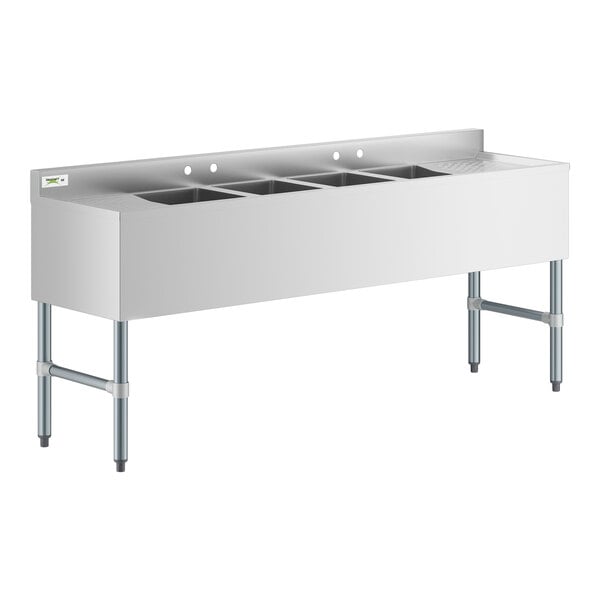 A stainless steel Regency underbar sink with four compartments.
