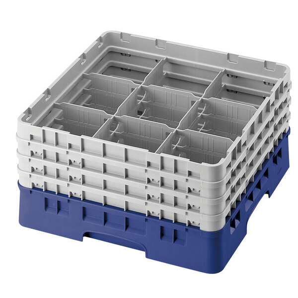 A blue Cambro glass rack with 9 compartments and an extender.