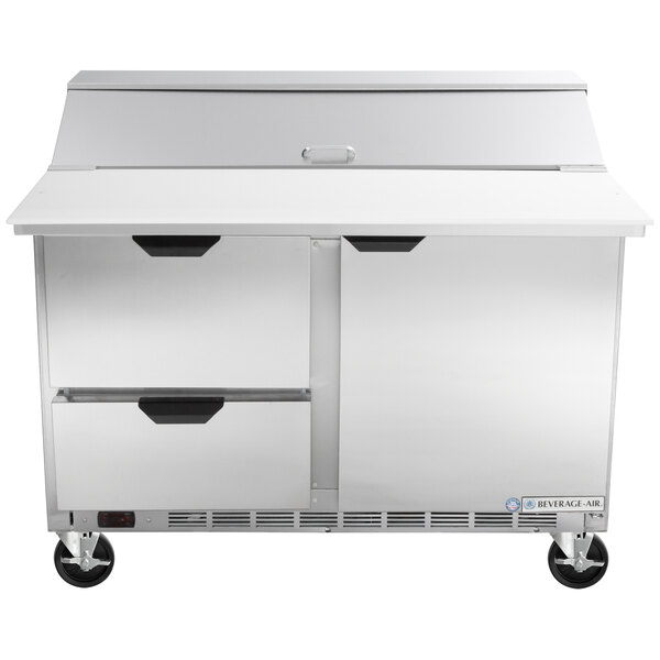 A stainless steel Beverage-Air refrigerator with 2 drawers and a cutting board.