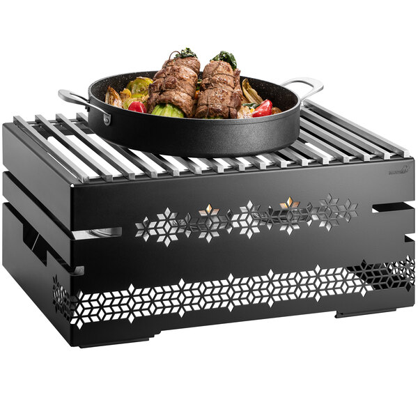 A Rosseto black chafer alternative grill with meat and vegetables in a pan on top.