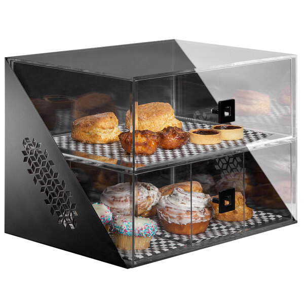 A Rosseto matte black acrylic bakery display case filled with pastries on two tiers.