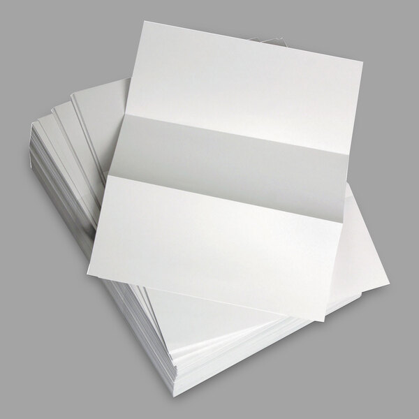 A stack of white Domtar custom cut-sheet copy paper.