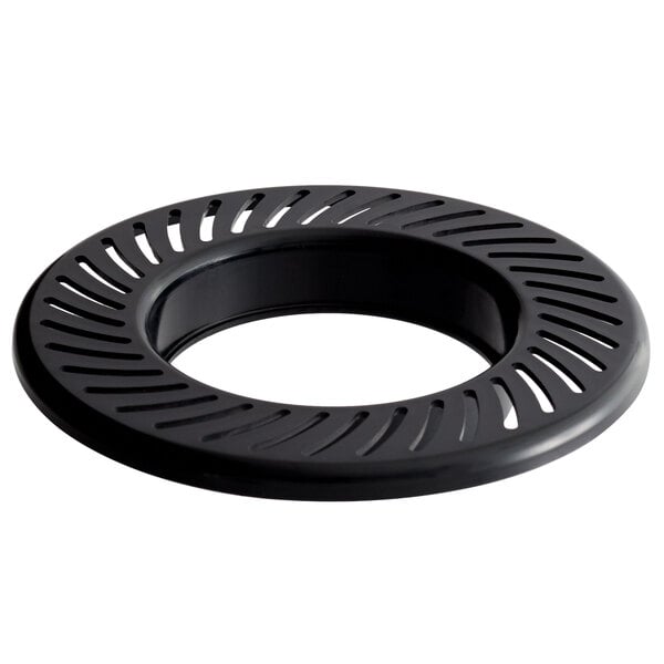 A black circular plastic pulp strainer with holes.