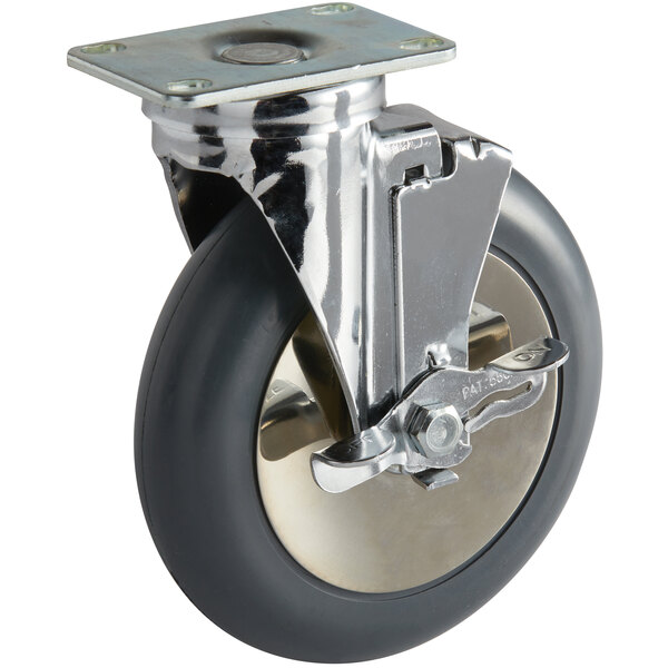 A metal and black swivel plate caster with a brake.