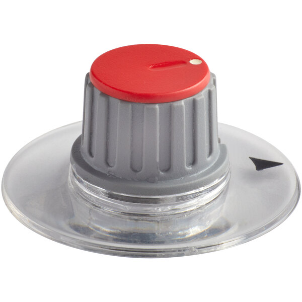 A clear plastic base with a red and black knob on top.
