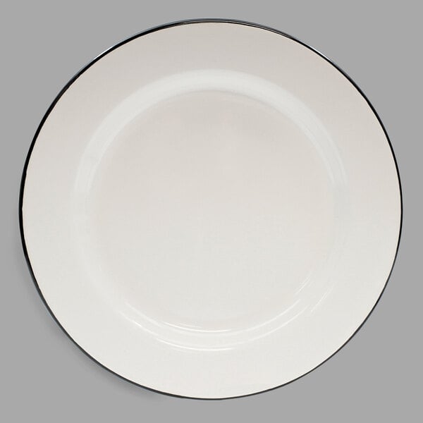 A Tablecraft enamelware plate with a black rim and cream white center.