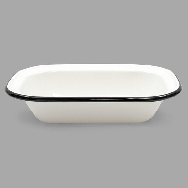 A white and black enameled Tablecraft rectangular bowl with a rim.