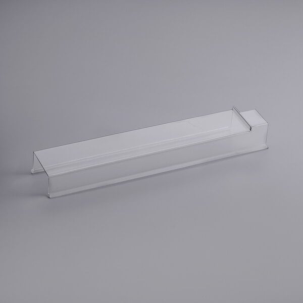 A clear plastic rectangular container with a long white rectangular handle.
