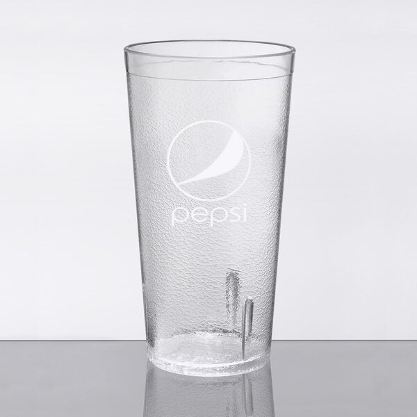 A clear plastic tumbler with the Pepsi logo on it.