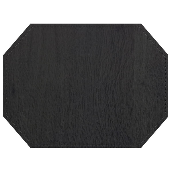 A black hexagon shaped Sherwood Shadow placemat with stitching.
