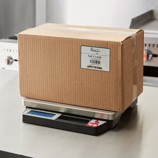 A box with a label on a Taylor Digital Receiving Scale.