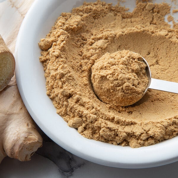 A spoon in a bowl of Regal ground ginger powder.