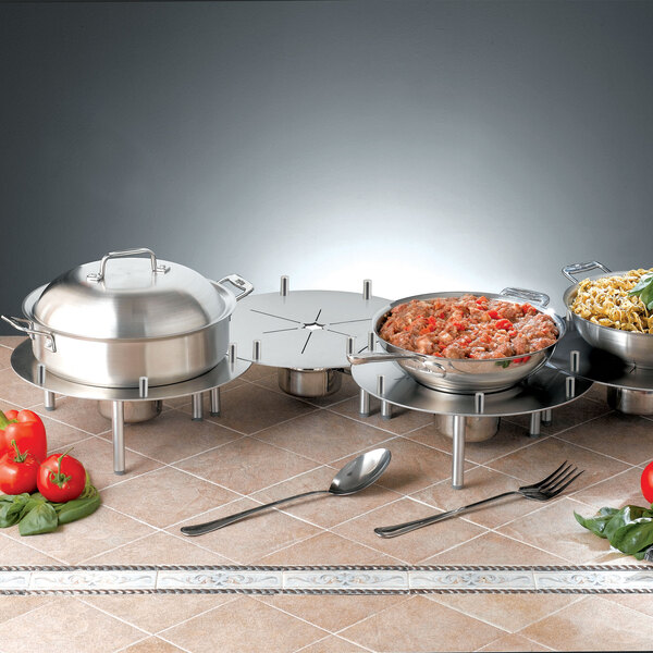 Stainless steel trays with food on a table using a Bon Chef Linking Chafer Alternative.