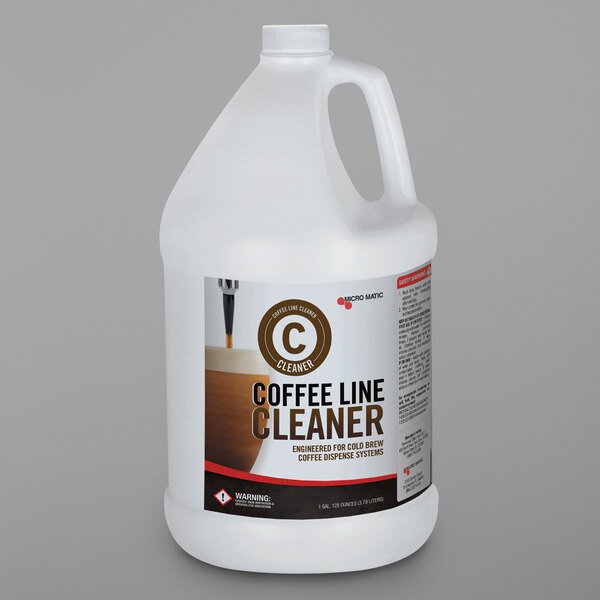 A white jug of Micro Matic 1 gallon liquid cold brew coffee line cleaner with a label.